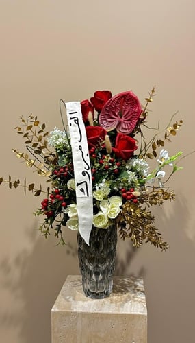 مزهريه ورد مُنسق بالزهور الصناعية