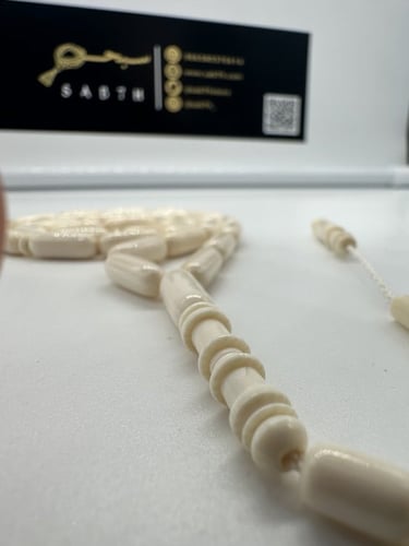 سبحة عاج افريقي قص صنوبري عدد الخرز 33