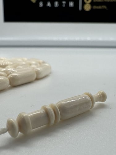 سبحة عاج افريقي قص صنوبري عدد الخرز 33