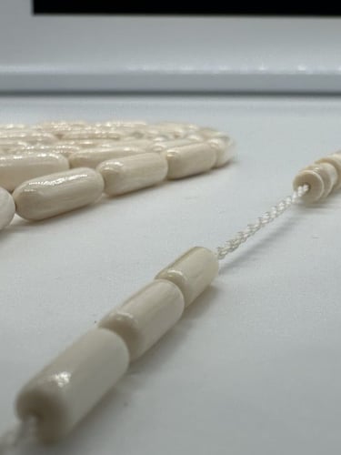 سبحة عاج افريقي قص صنوبري عدد الخرز 33