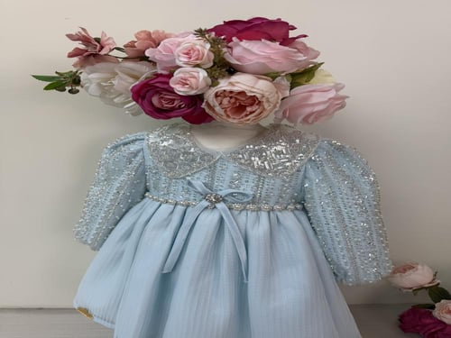 فستان مزين بالخرز للمواليد