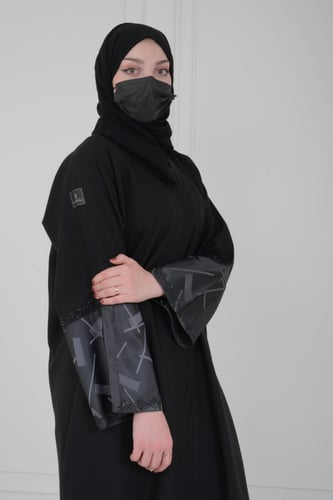 عباية lavania عباية عملية صممت بتداخلات في الامام...