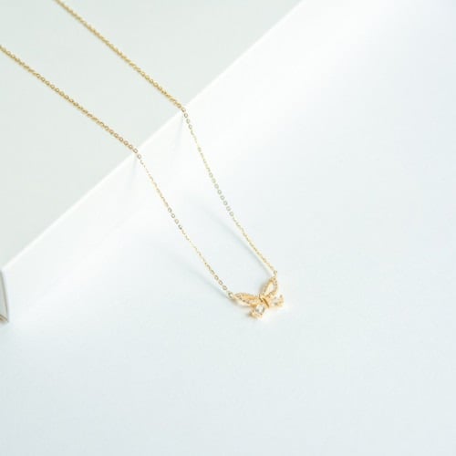 طقم أنيق مكون من قطعتين باللون الذهبي (SET884) .