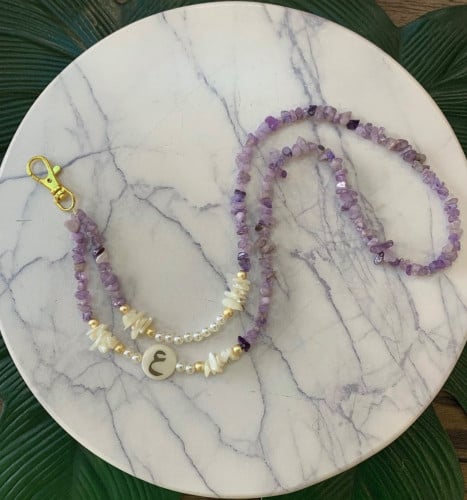 تعليقه بطاقه حجر بنفسجي