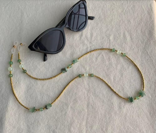 تعليقه نظاره خرز ذهبي وحجر اخضر