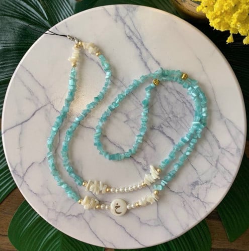 تعليقات جوال تركوازي مع حرف عادي