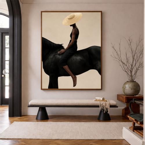 A fabric painting with a horse design and a hollow frame