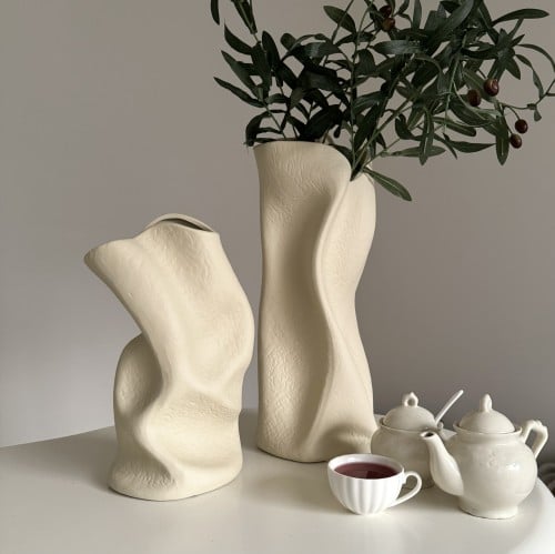 A beige conical vase