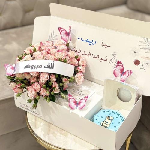 Box of flowers and cake