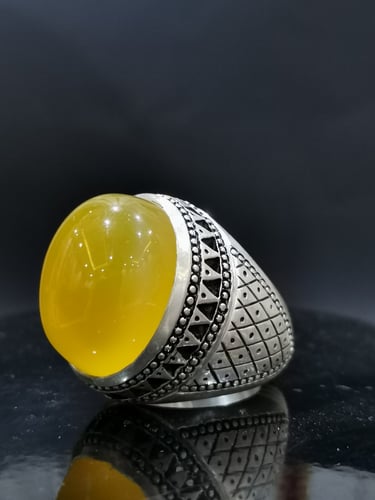 خاتم الفضة بحجر خرساني ايراني أصفر بصياغة الخفاش ا...
