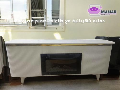 دفاية كهربائية مع طاولة بتصميم أنيق وجذاب