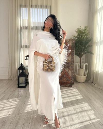 فستان العيد قطعتين ابيض بالريش مع لمسة الكرستال ال...