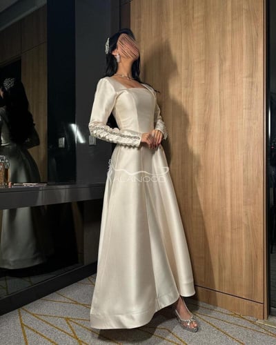 فستان سهرة بيج ساتر باكمام مطرزة كرستال