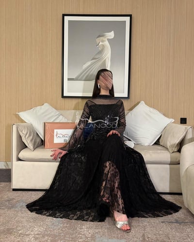فستان سهرة اسود بكلفة لامعه