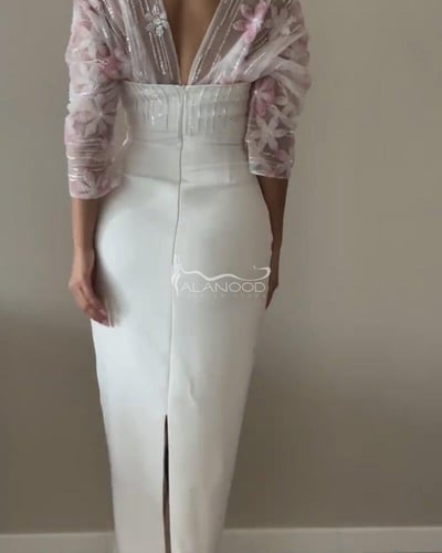 فستان العنود ابيض مطرز بكلفة رسمة الورود