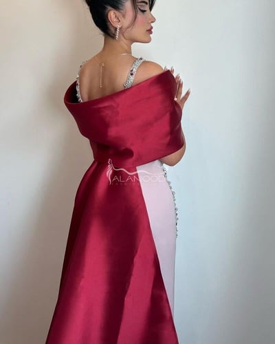 فستان سهرة ماسك بذيل أنيق من الخلف بتصميم فاخر ومم...