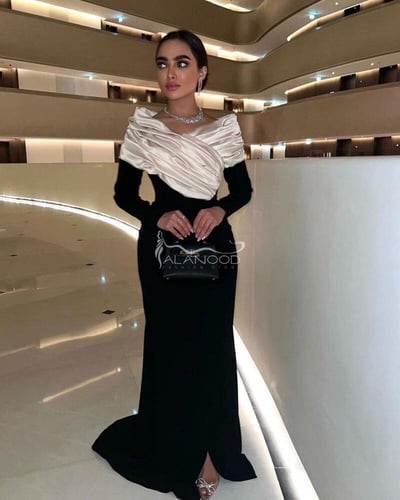 فستان سهرة ساتر و طويل أنيق بتصميم عصري فاخر