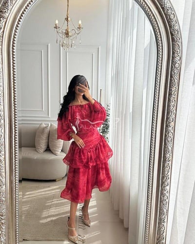 فستان فوشي بخامة اورجانزا بتصميم أنيق