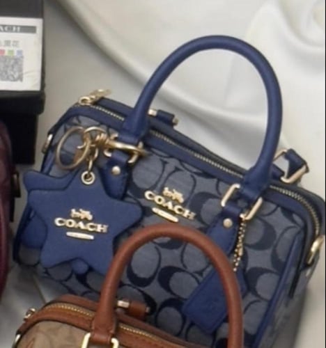 شنطه ماركه كوتش تعليقه نجمه