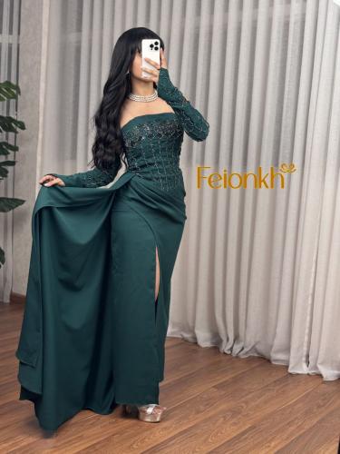 فستان اخضر تطريز يدوي في الصدر والاكمام