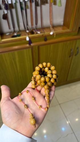 A round pressed cocobolo wood fruit
