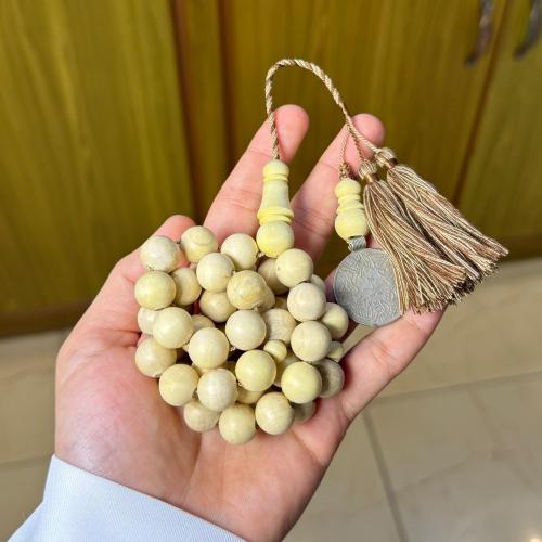 Wooden orange prayer bead with round story design...