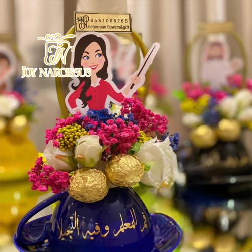 توزيعات أكواب يوم المعلم