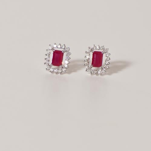 Diamond ring, white gold, and red gemstone