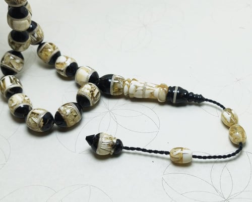 سبحة النوادر (عاج، كهرمان، كوك) - تصميم "النجف" ال...