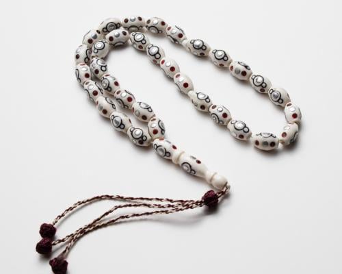 سبحة عظم جمل مطعم بالزركون الأحمر 33 حبة