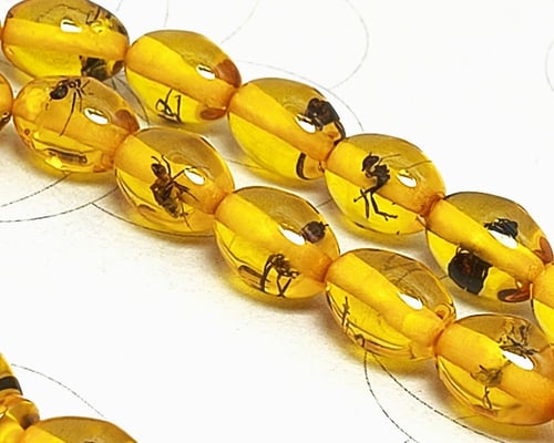 تراب الكهرمان عسلي محشر 33 خرزة