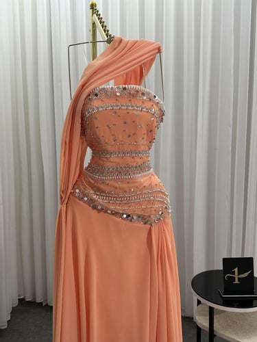 فستان سهرة مشمشي بكريستالات