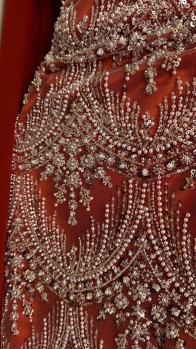 فستان سهرة برتقالي غامق مطرز كريستال