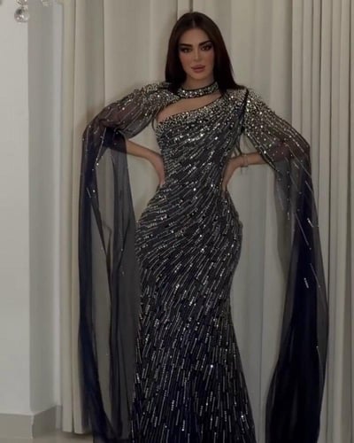 فستان سهرة أسود مرصع بالكريستال مع كاب شفاف|فستان...