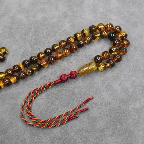 سبحة كهرمان شوائب طبيعي