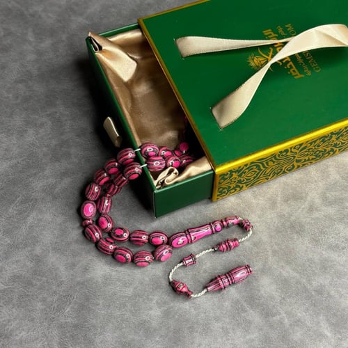 سبحة خشب مضغوط زهري