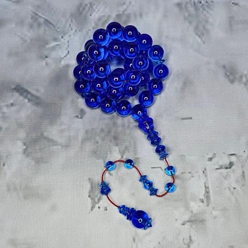 سبحة كاست ازرق شفاف تمليكة