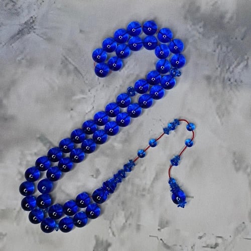 سبحة كاست ازرق شفاف تمليكة