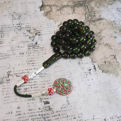 سبحة زعفراني لون زيتي مع طربزونه فضه