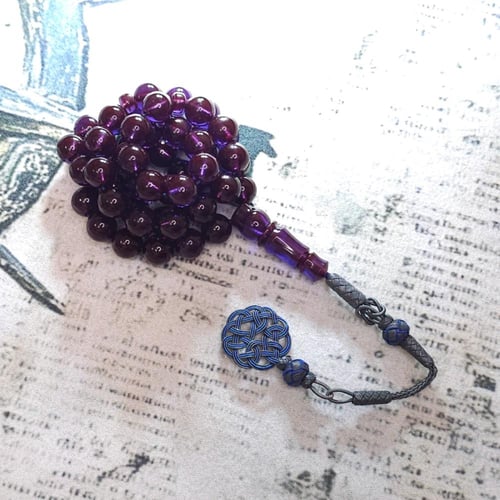 سبحة زعفراني لون حرباء مع طربزونه فضه