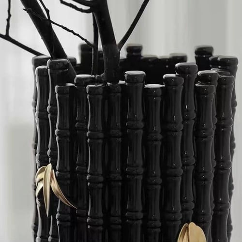 مزهرية بنمط خيزران مزين باوراق شجر ذهبي