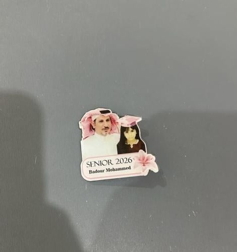 Graduation badge customized with two photos and the name 2026