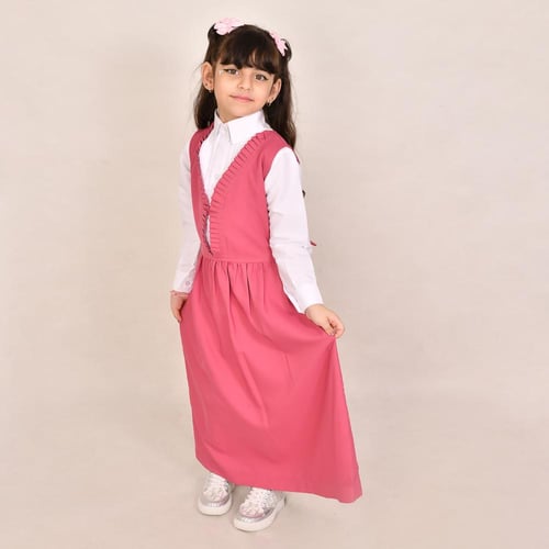 مريول ابتدائي وردي بكشكش ناعم في المنتصف وربطت إغل...