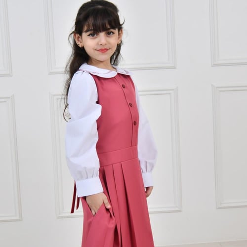 مريول أبتدائي وردي مزين بفيونكة