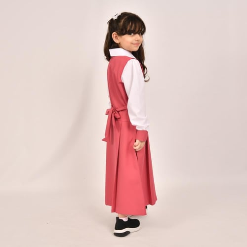 مريول ابتدائي وردي فاتح بكشكش عريض على الاكتاف وكس...