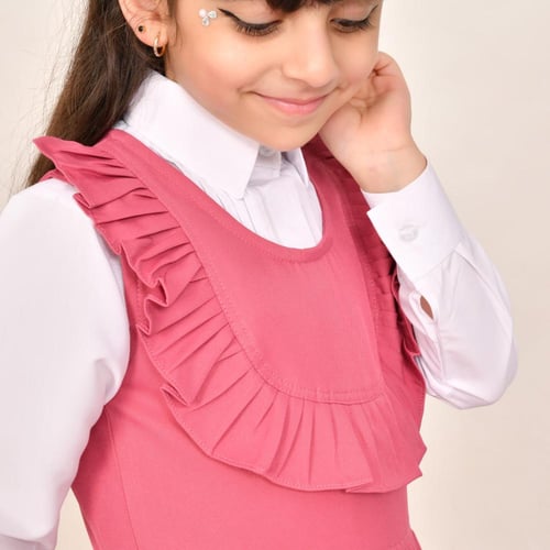 مريول ابتدائي وردي ياقة دائرية وكشكش عريض