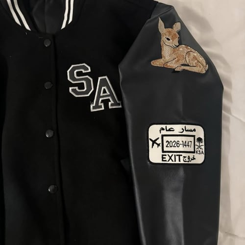 جاكيت اسود أكمام رصاصي جلد