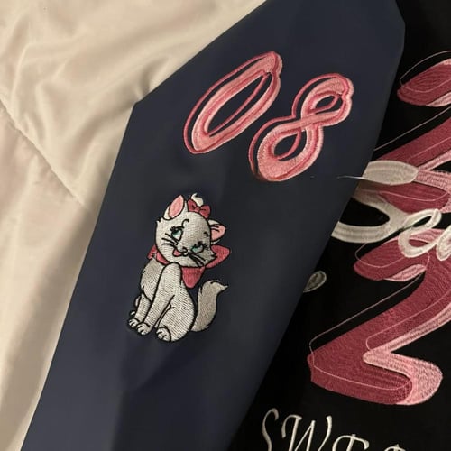 جاكيت اسود أكمام كحلي جلد