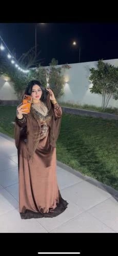A brown dress with a headscarf