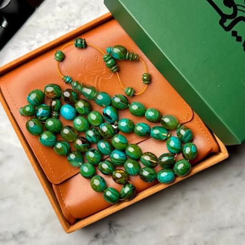 سبحة من عصي فيروزي معرق بيضاوي